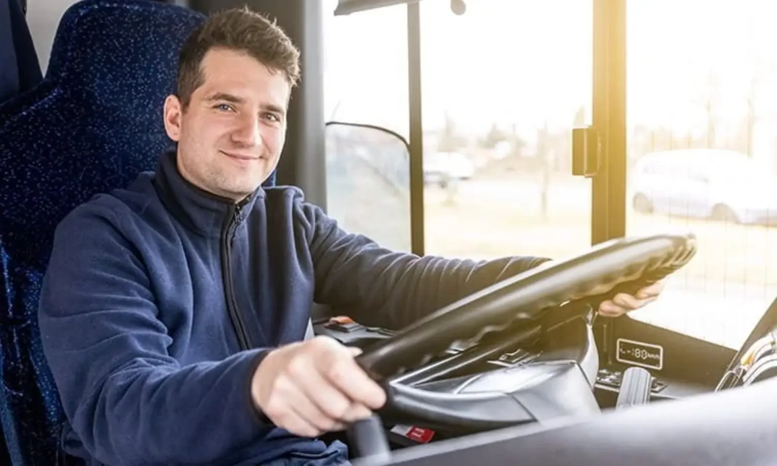 A Big D's driver in uniform beside a vehicle