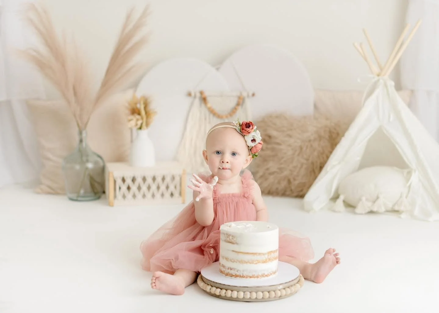 First birthday cake smash setup photographed in Syracuse, NY