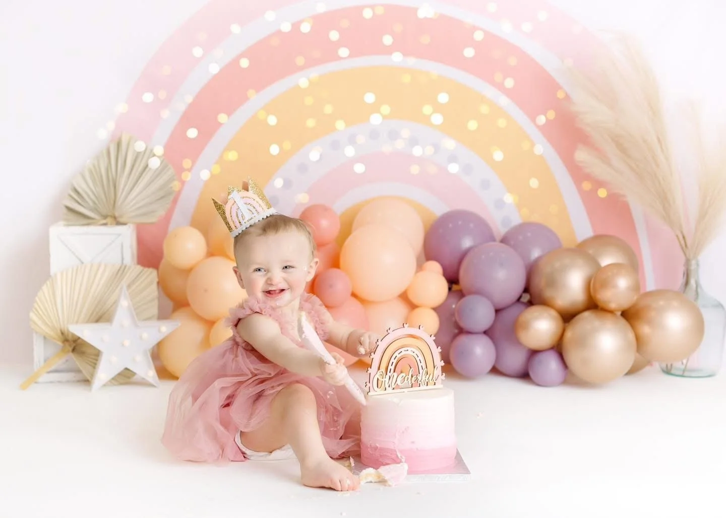 One-year-old with a styled cake at a Syracuse cake smash session