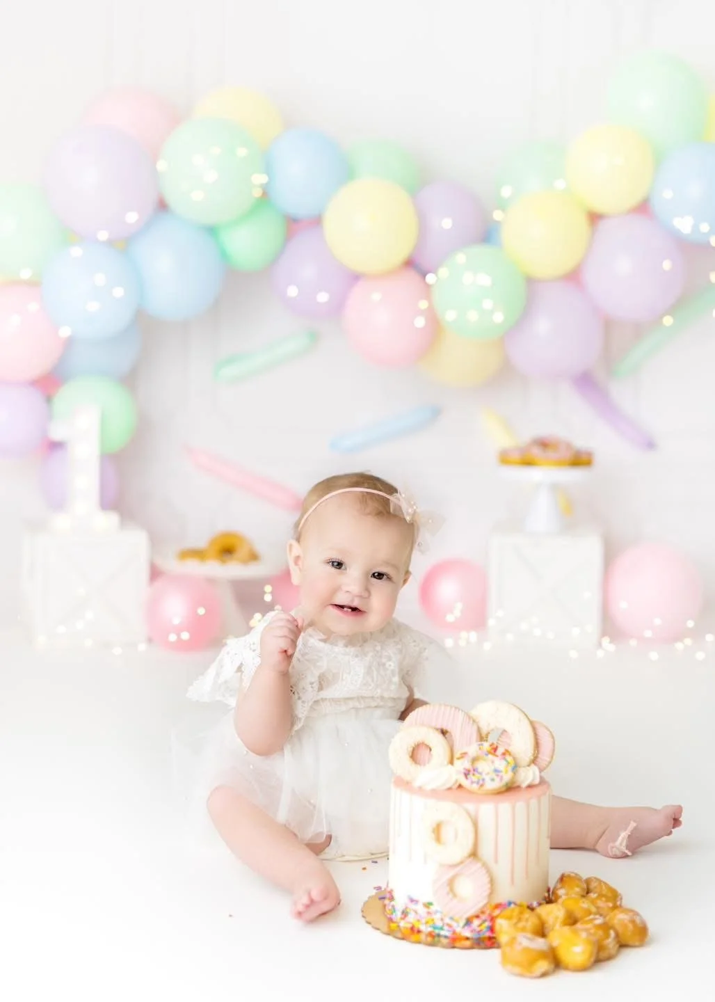 First birthday cake smash setup photographed in Syracuse, NY