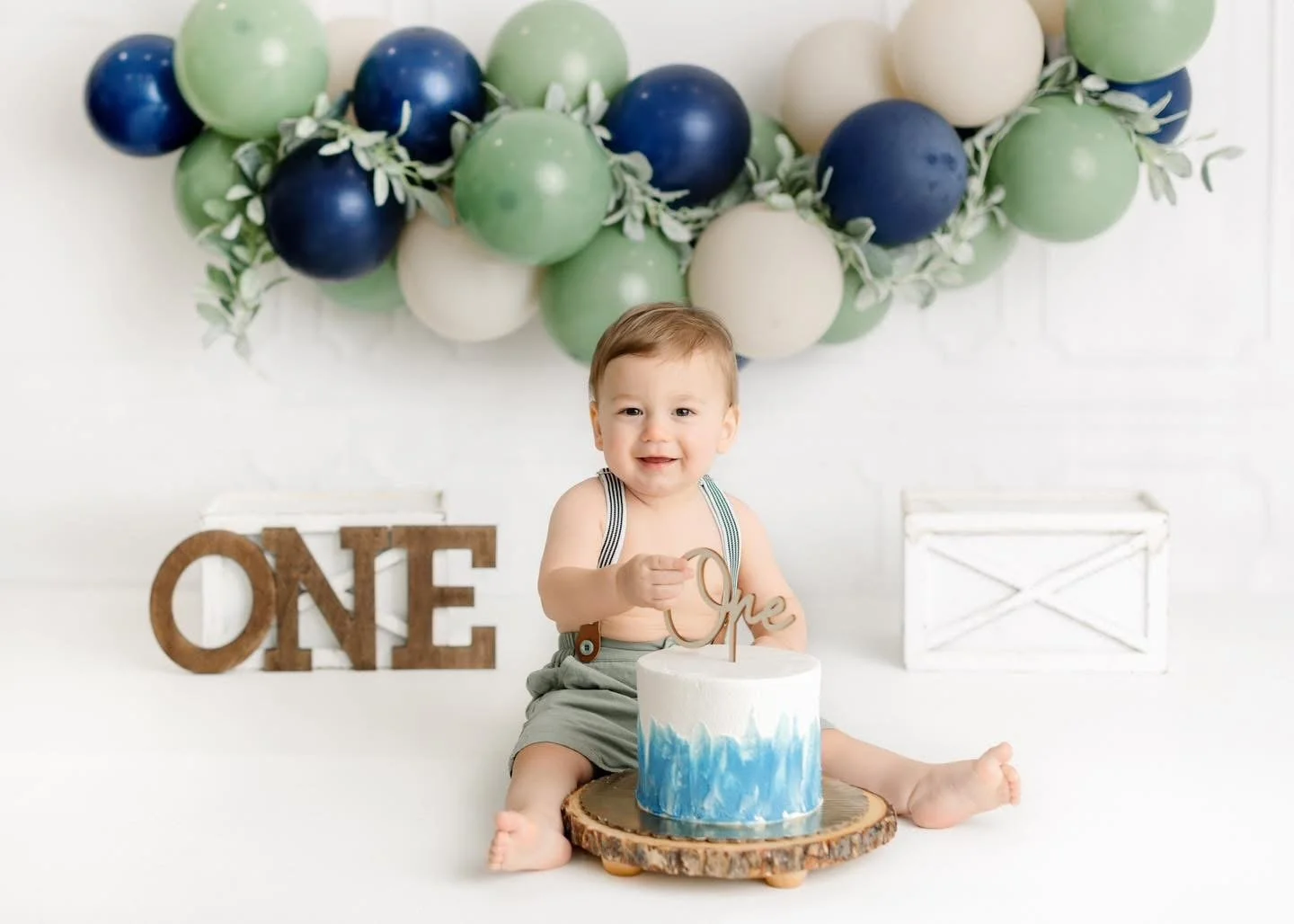 First birthday cake smash setup photographed in Syracuse, NY