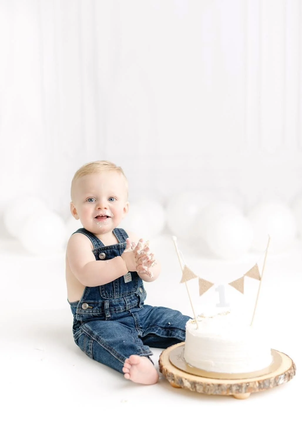 First birthday cake smash setup photographed in Syracuse, NY