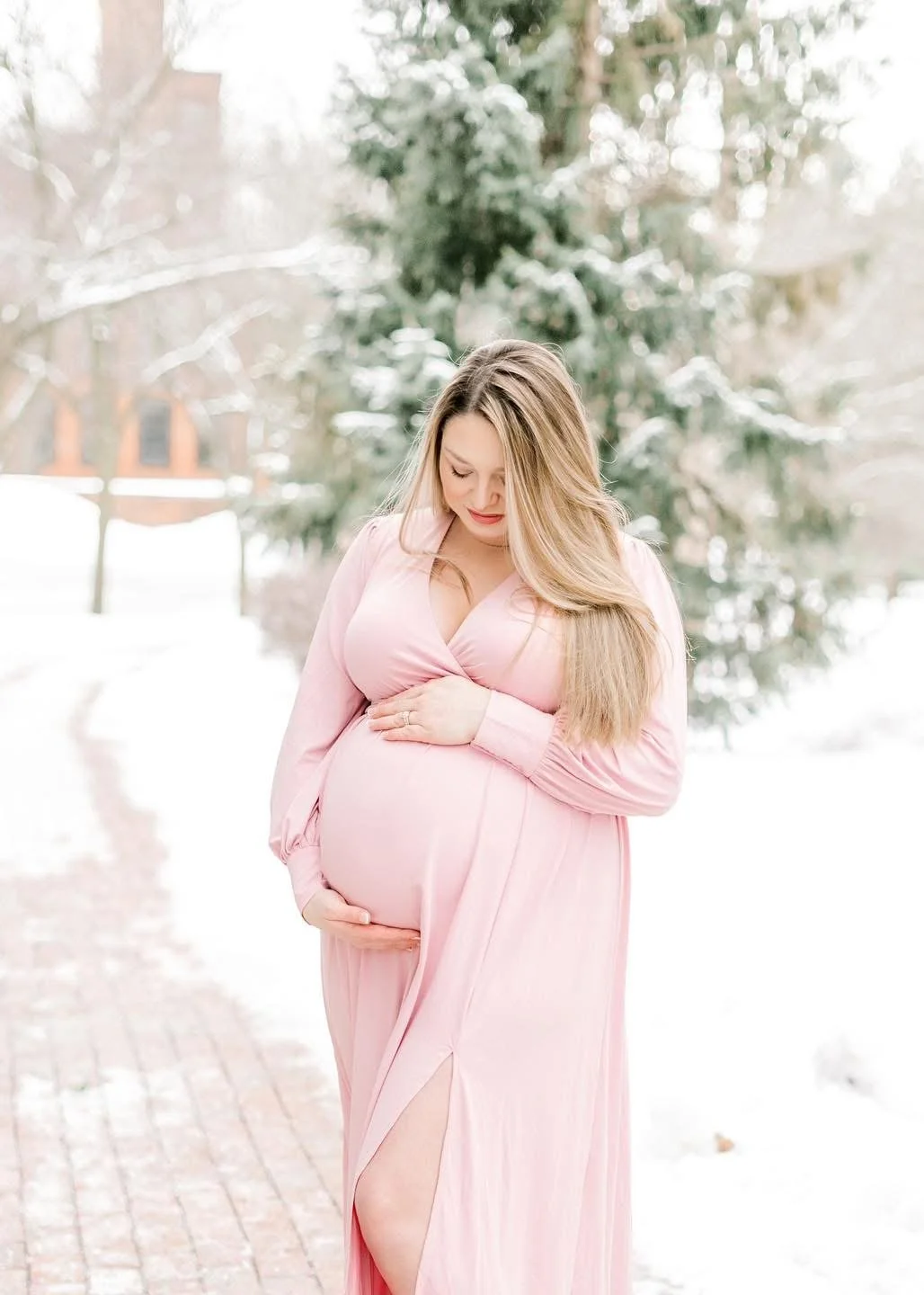 Expectant parents photographed together during a maternity session