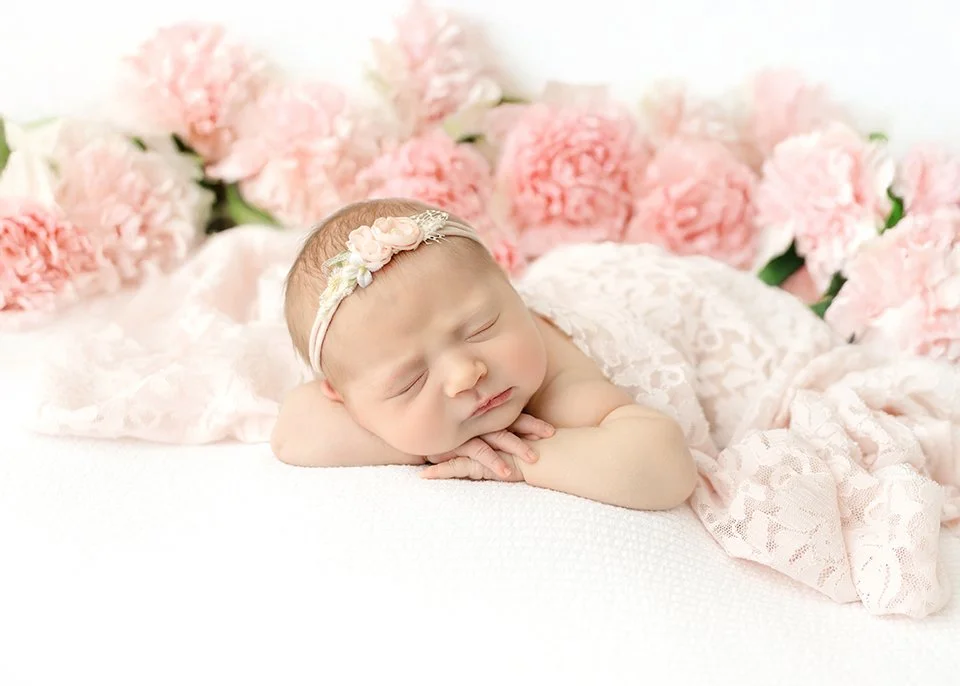 Newborn baby swaddled and sleeping in the Syracuse, NY studio
