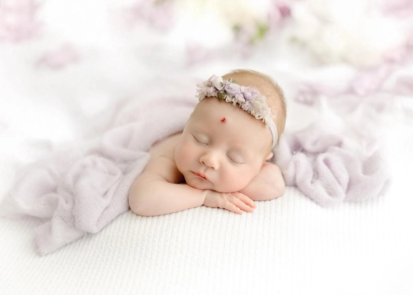 Newborn baby swaddled and sleeping in the Syracuse, NY studio