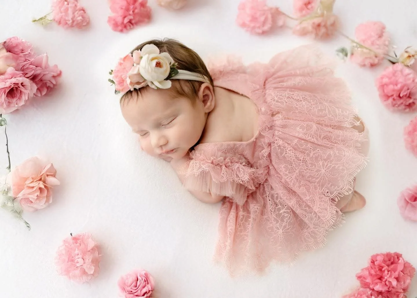 Newborn resting on a knitted blanket at a Central New York studio session