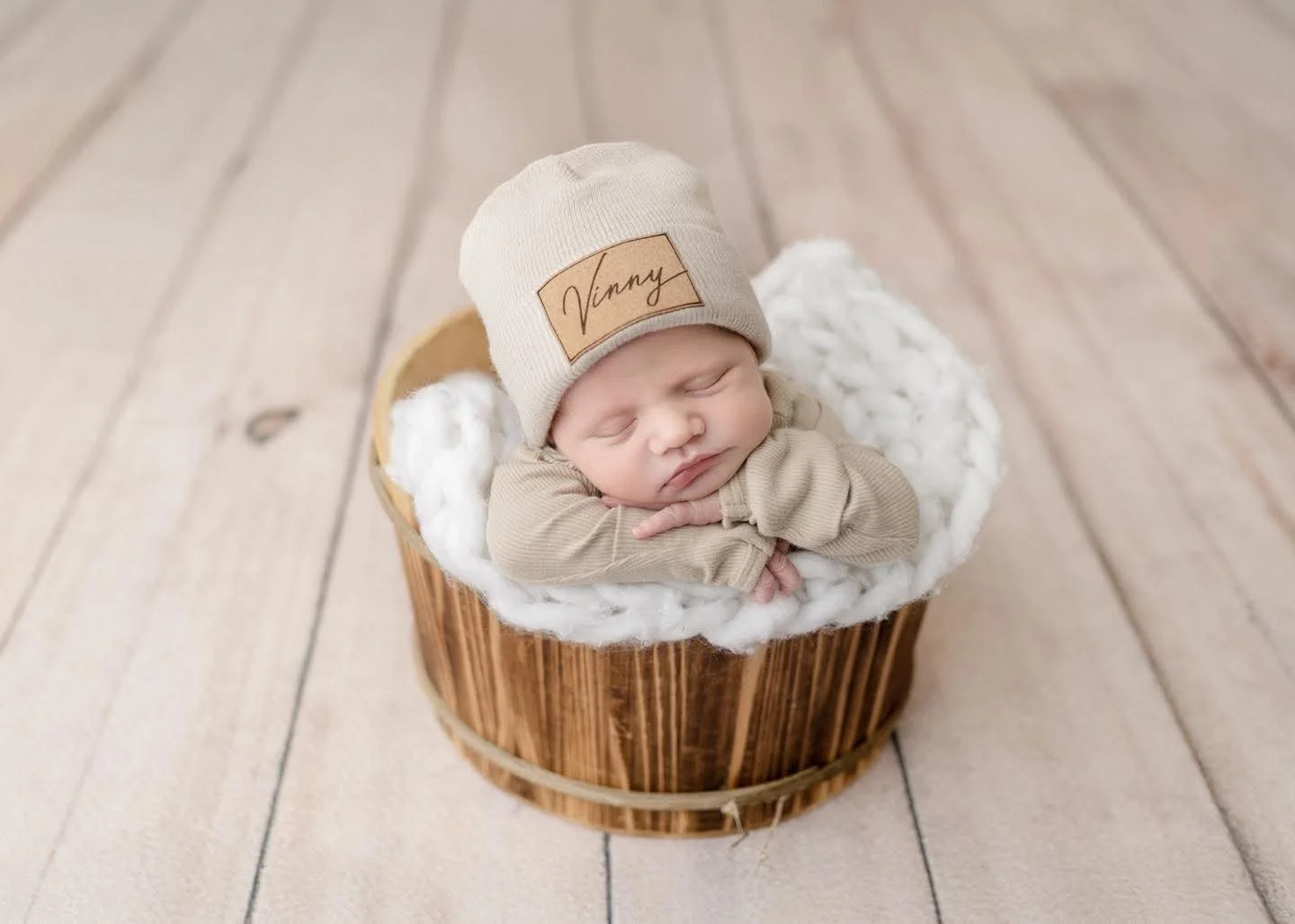 Newborn resting on a knitted blanket at a Central New York studio session